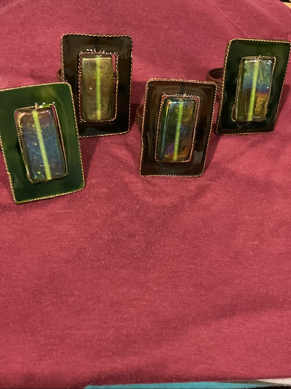 Pier one iridescent glass and copper napkin rings.
